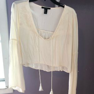 Cream colored v-neck crop top